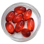 Close view of red krill oil softgel capsules
